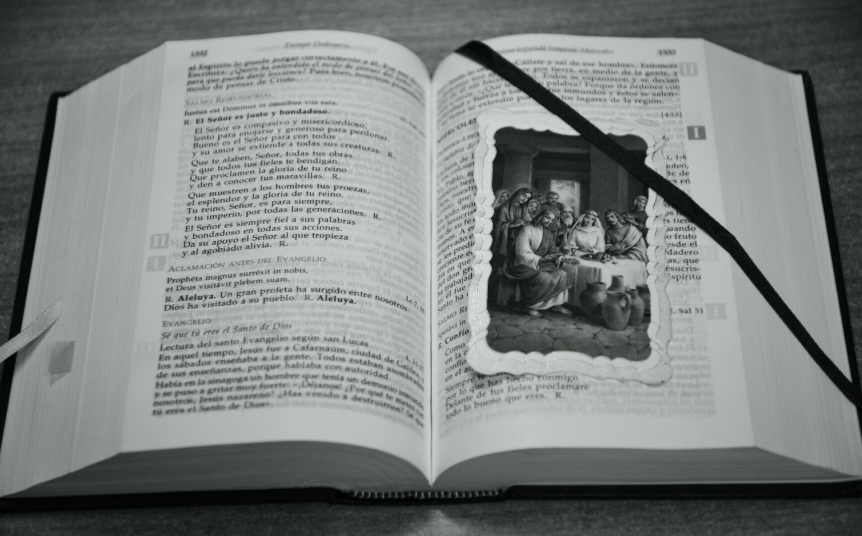 An open bible with jesus family photo under the bookmark