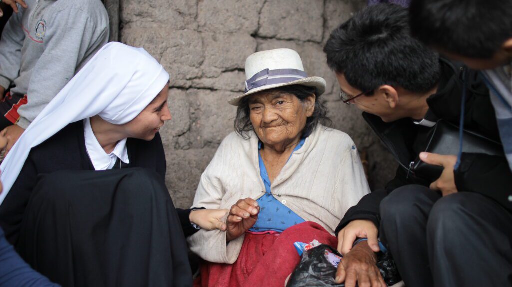 The photo shows a kind and loving gesture to the poor. 