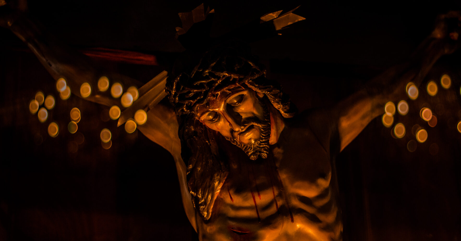Closeup shot of crucifix with dripping blood