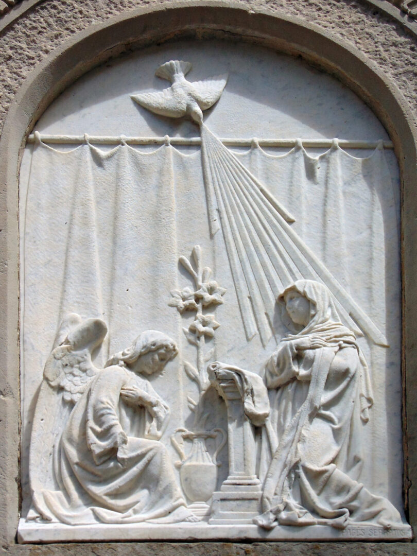Jesus family with flower pot and bird carving on white wall