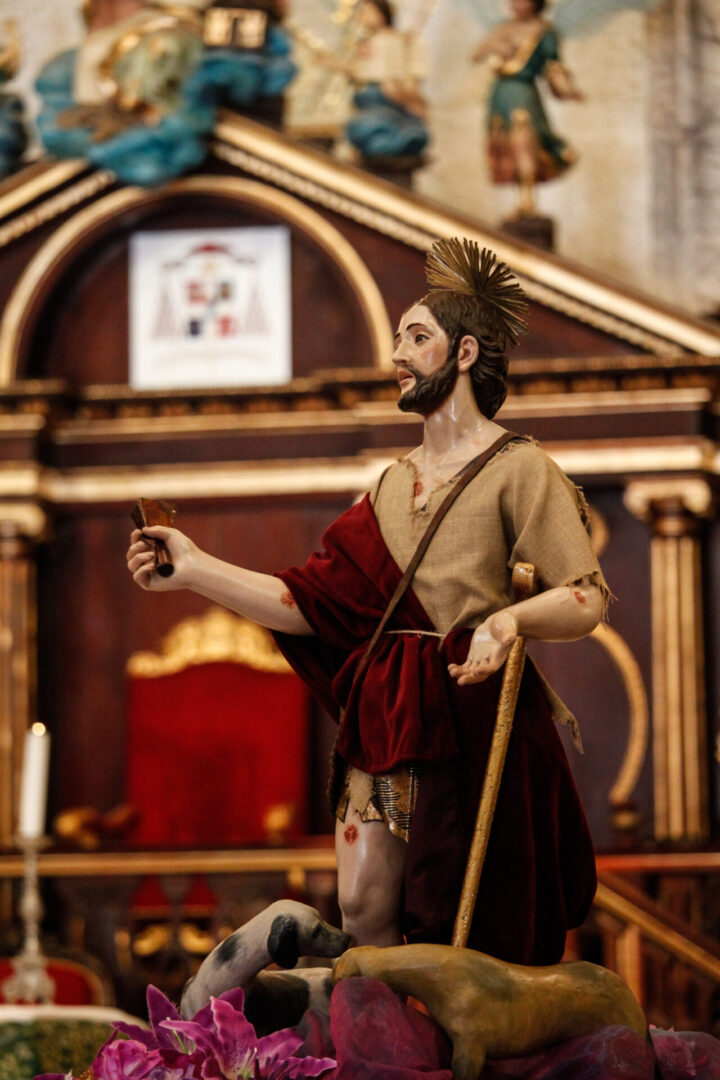 Saint Lazarus wearing beige color and red cloth